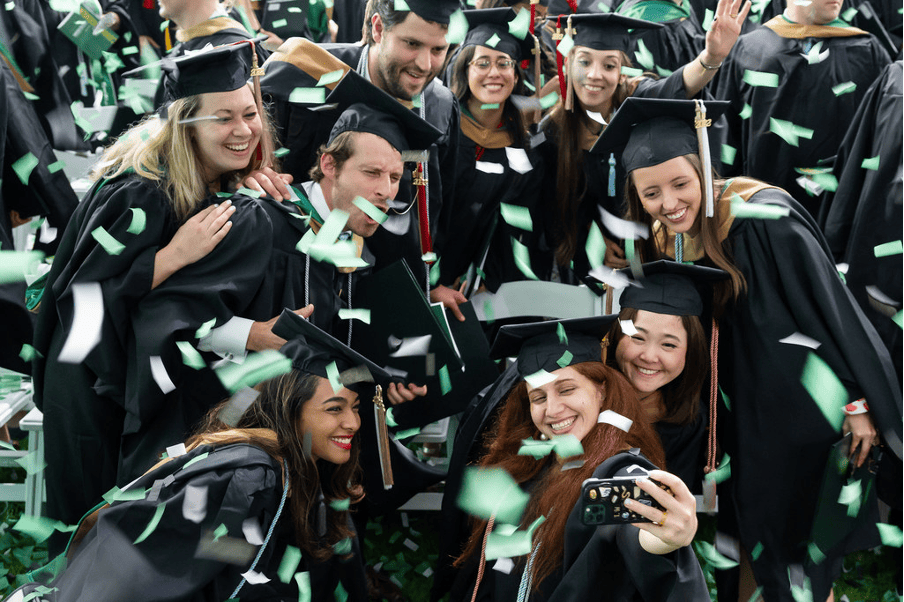 Babson College MBA graduates celebrating with confetti
