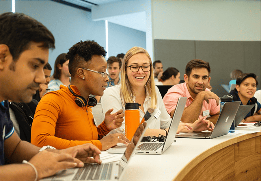 Diverse group of students working together at McCombs School of Business