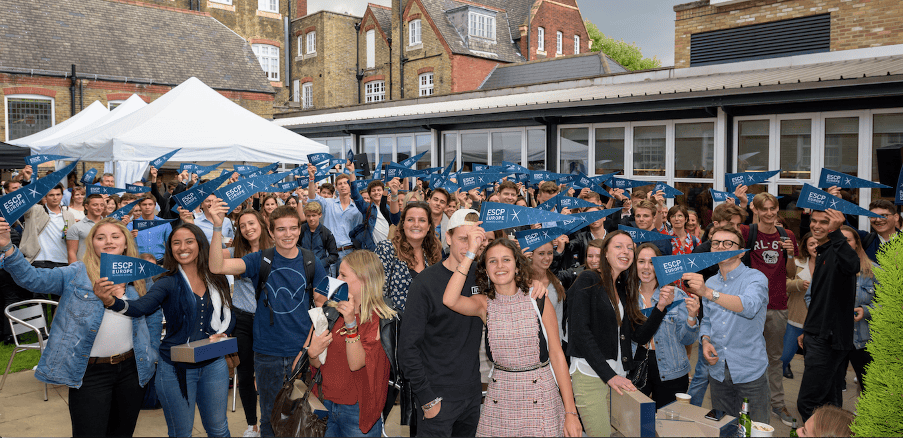 ESCP students holding flags at a celebration event