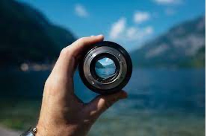 Camera lens focusing on a clear landscape, analogy for targeted GMAT study approach