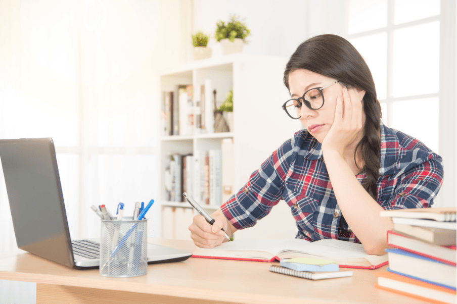 A student studying diligently at the McCombs School of Business