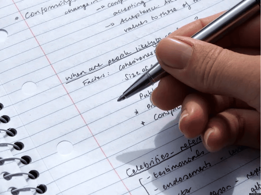 Close-up of handwritten notes on business studies