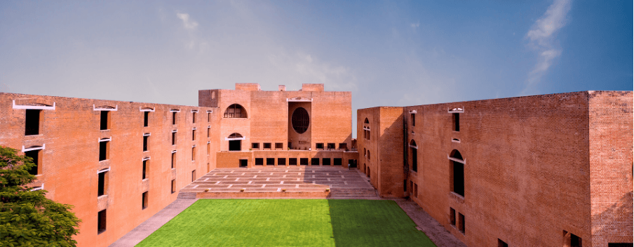 Iconic brick architecture of IIMA with an open courtyard.