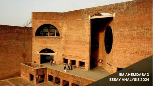 Brick structure of IIMA with students gathering at the entrance.