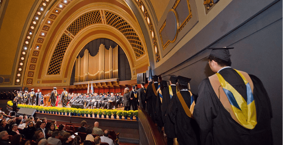MBA graduation ceremony with graduates in an auditorium