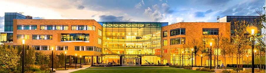 Exterior view of Tepper School of Business at Carnegie Mellon University at dusk