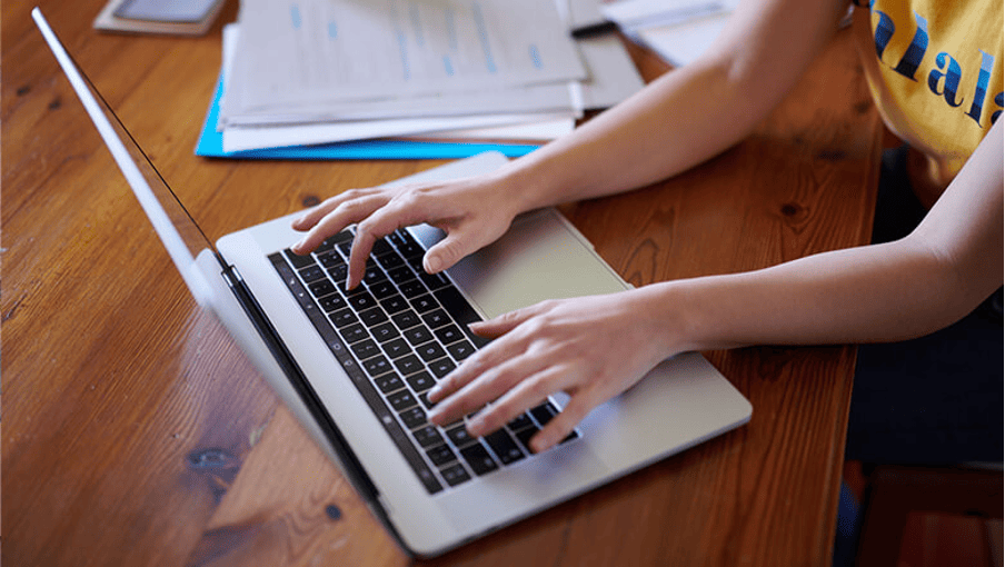 UCLA Anderson student working on laptop